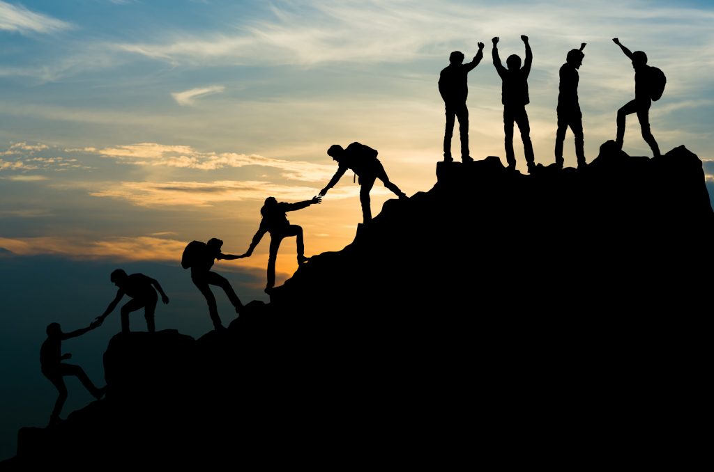 Group of people on peak mountain climbing